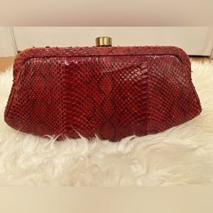 Vintage Snakeskin Red leather clutch, with gold clasp
Good used condition.